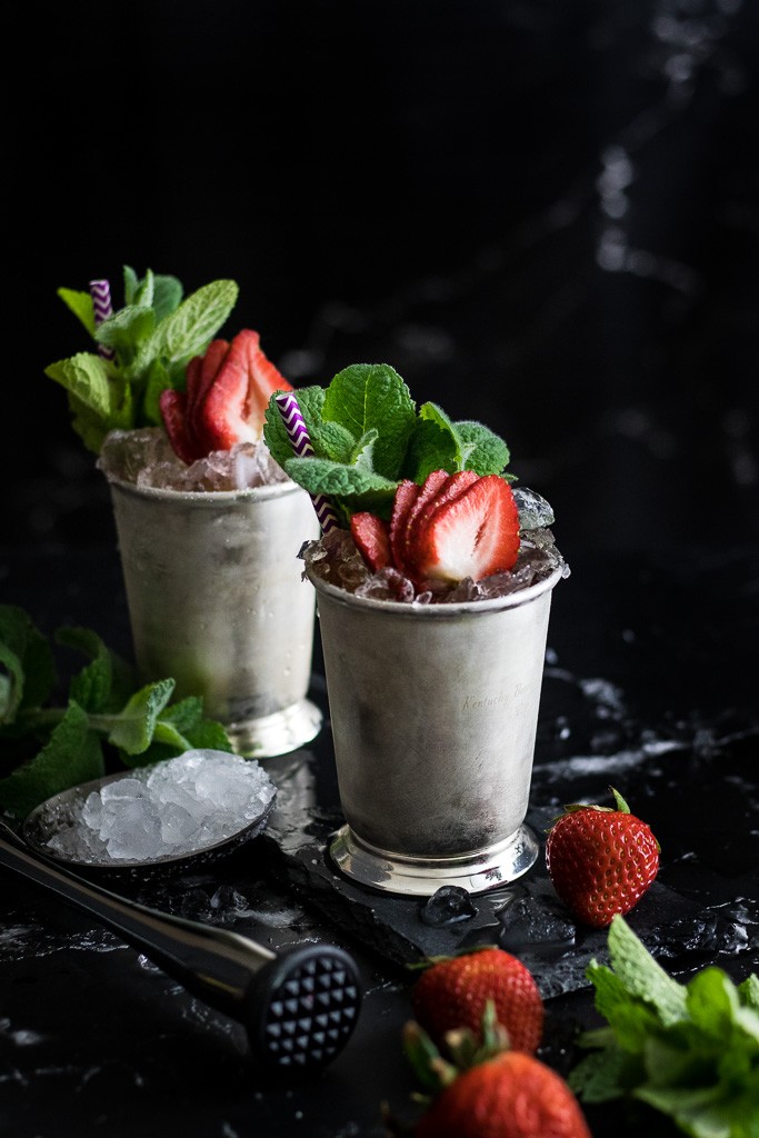 Strawberry Mint Julep garnished with fresh strawberries and mint sprigs