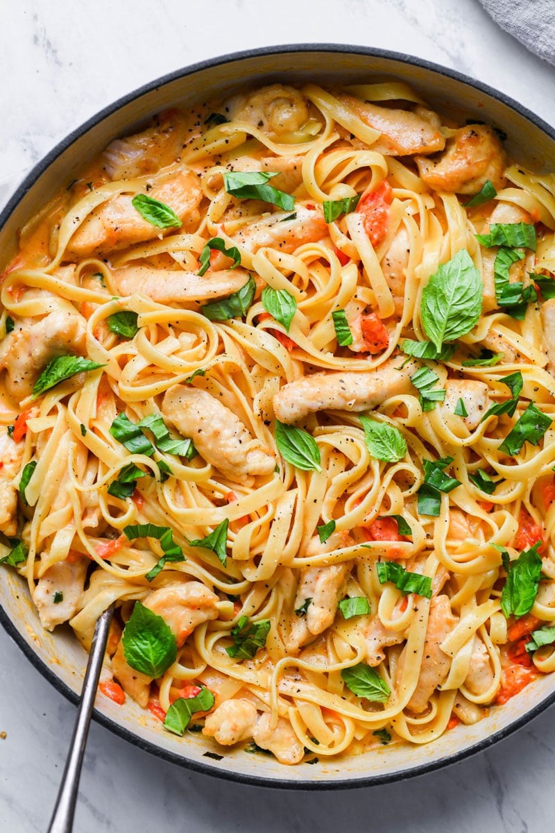 creamy tomato basil chicken dinner plate served with pasta