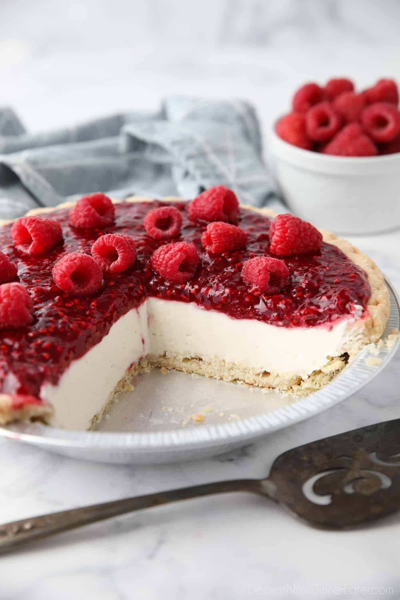 slice of raspberry cream pie with fresh raspberries on top