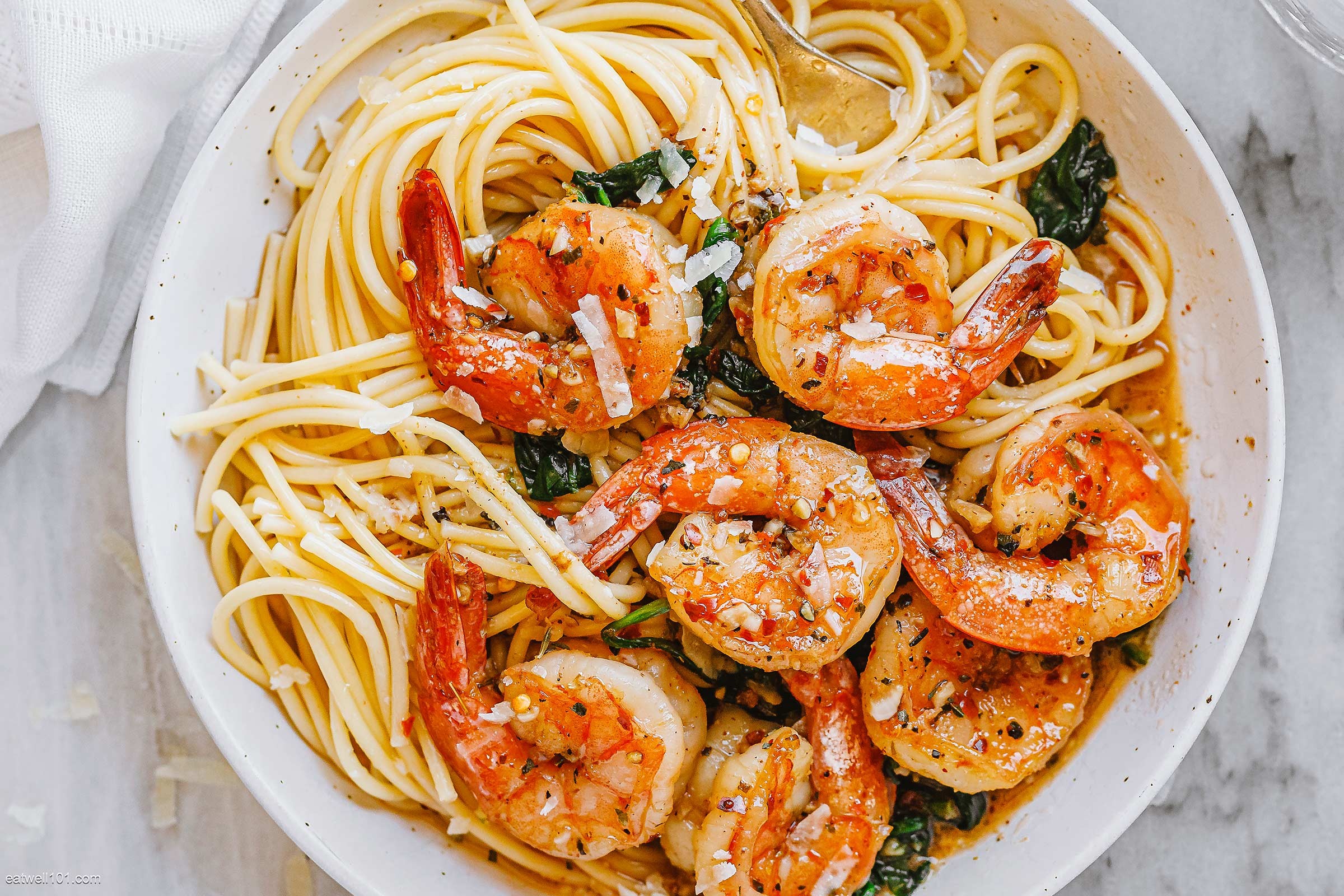 Close-up shot of a plate of Garlic Shrimp & Spinach Salsa Pasta, showing the vibrant colors and textures of the dish
