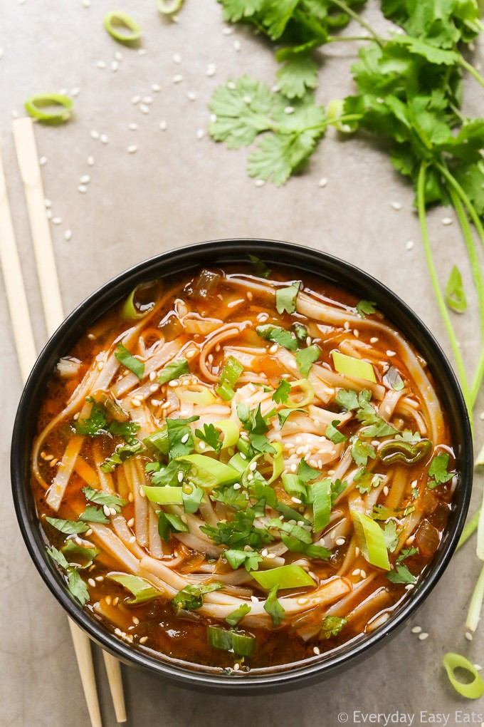 bowl of spicy sriracha tofu noodle vegan soup
