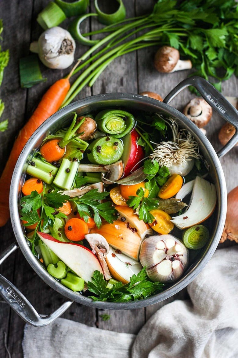 A vibrant, colorful vegetable broth simmering in a pot
