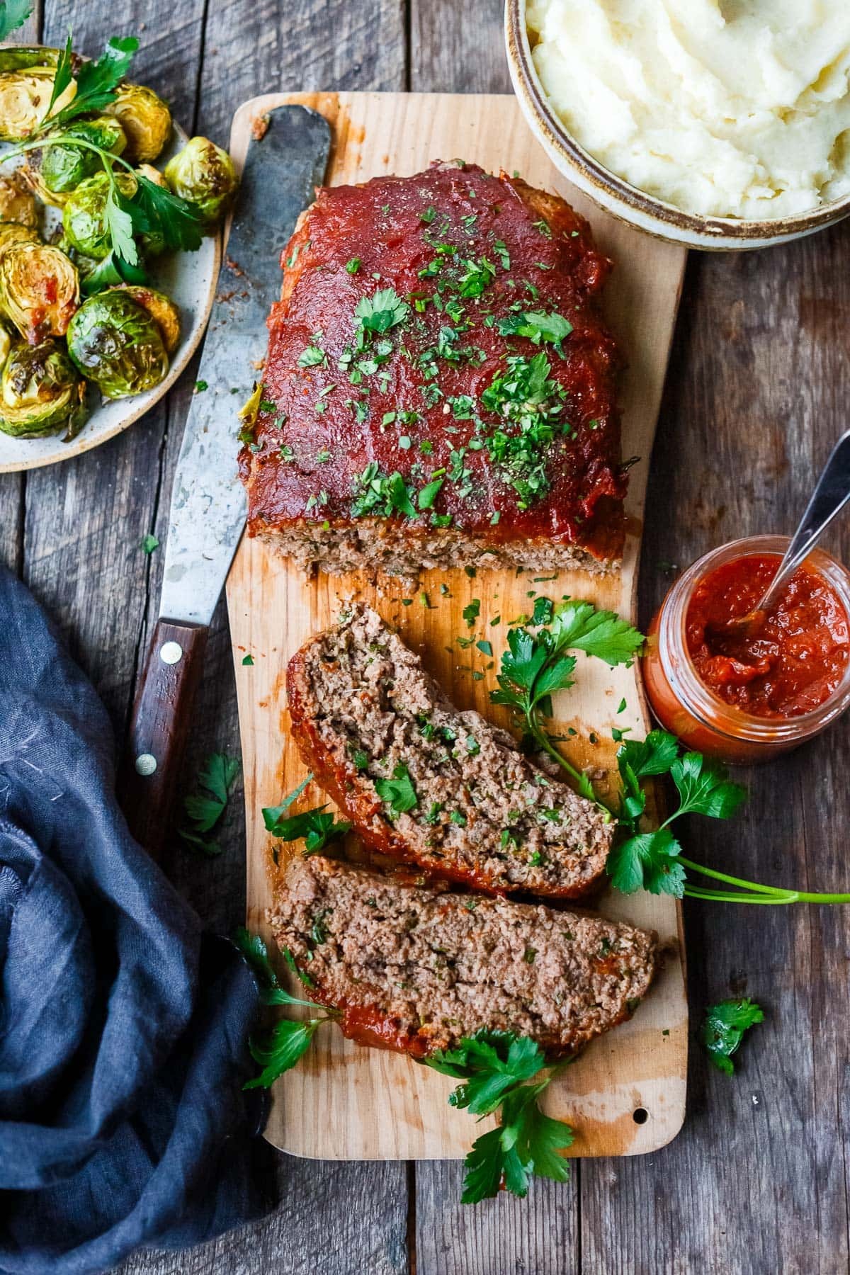 homemade meatloaf on a wooden cutting board