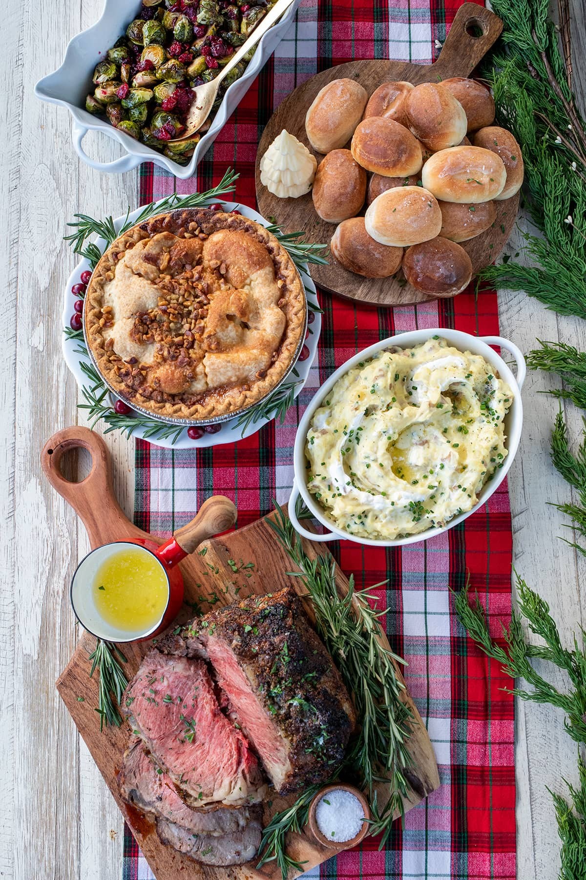 Delicious golden-brown garlic butter roast with herbs on a festive table