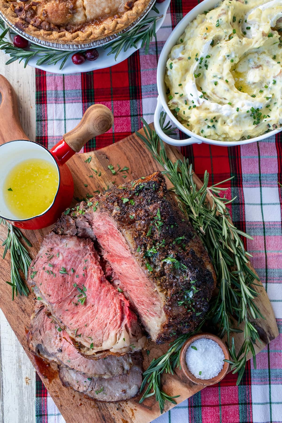 beautifully roasted beef with garlic butter, surrounded by festive holiday decor