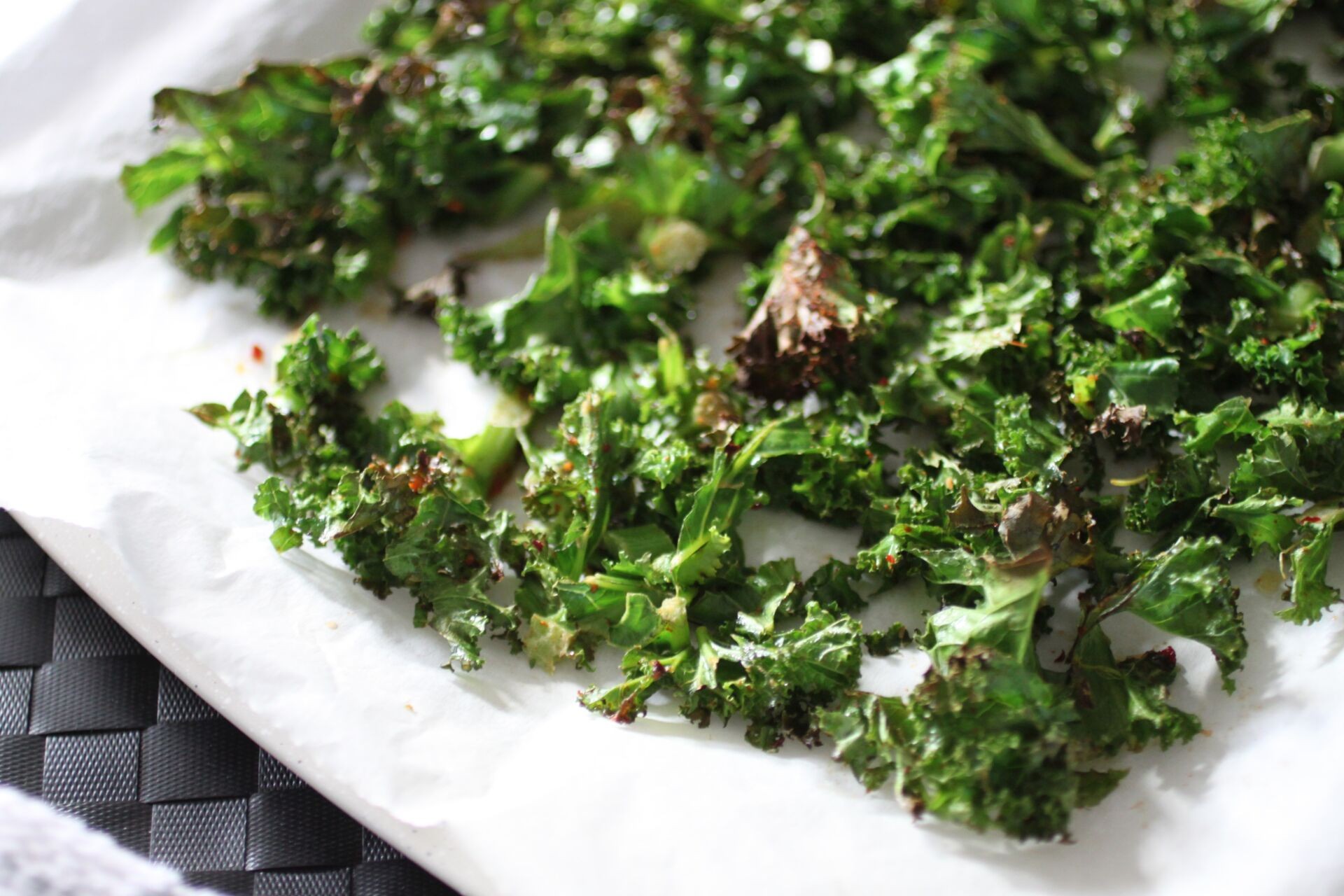 Crispy sweet chili kale stem chips on a baking sheet
