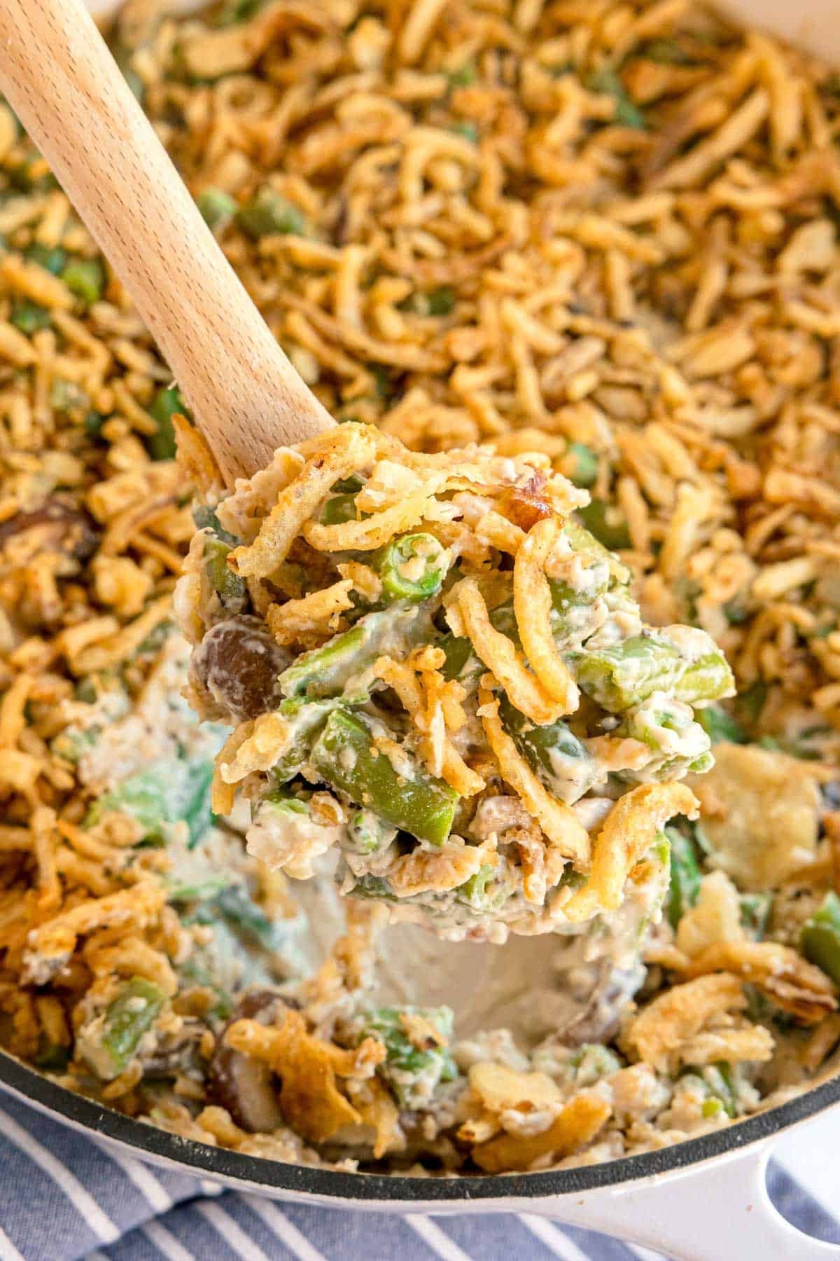 homemade green bean casserole with golden buttery crumb crust, fresh out of the oven, cozy kitchen background