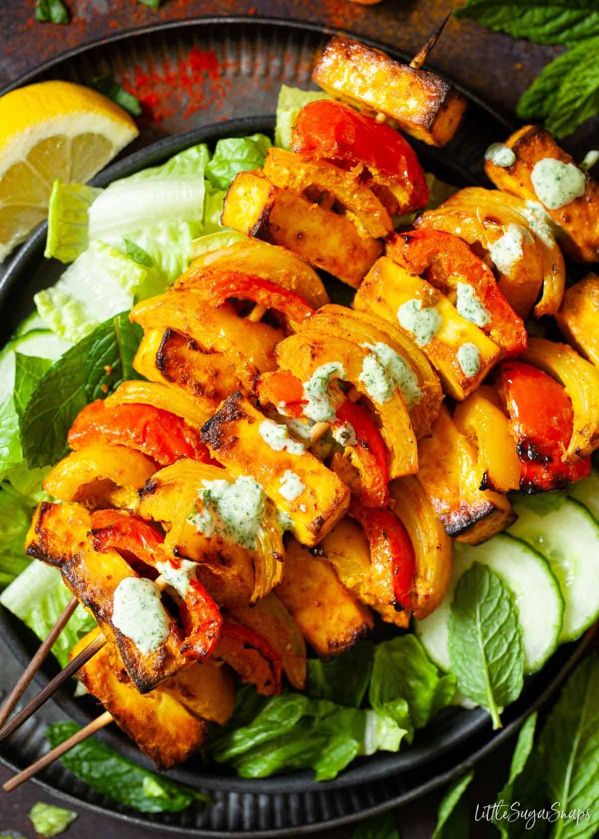 Smoked Paneer Tikka Skewers on a Grill, close up shot