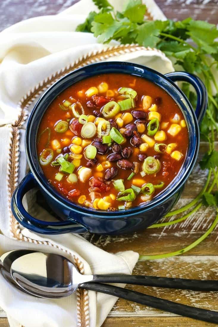 bowl of black bean and corn soup topped with cilantro