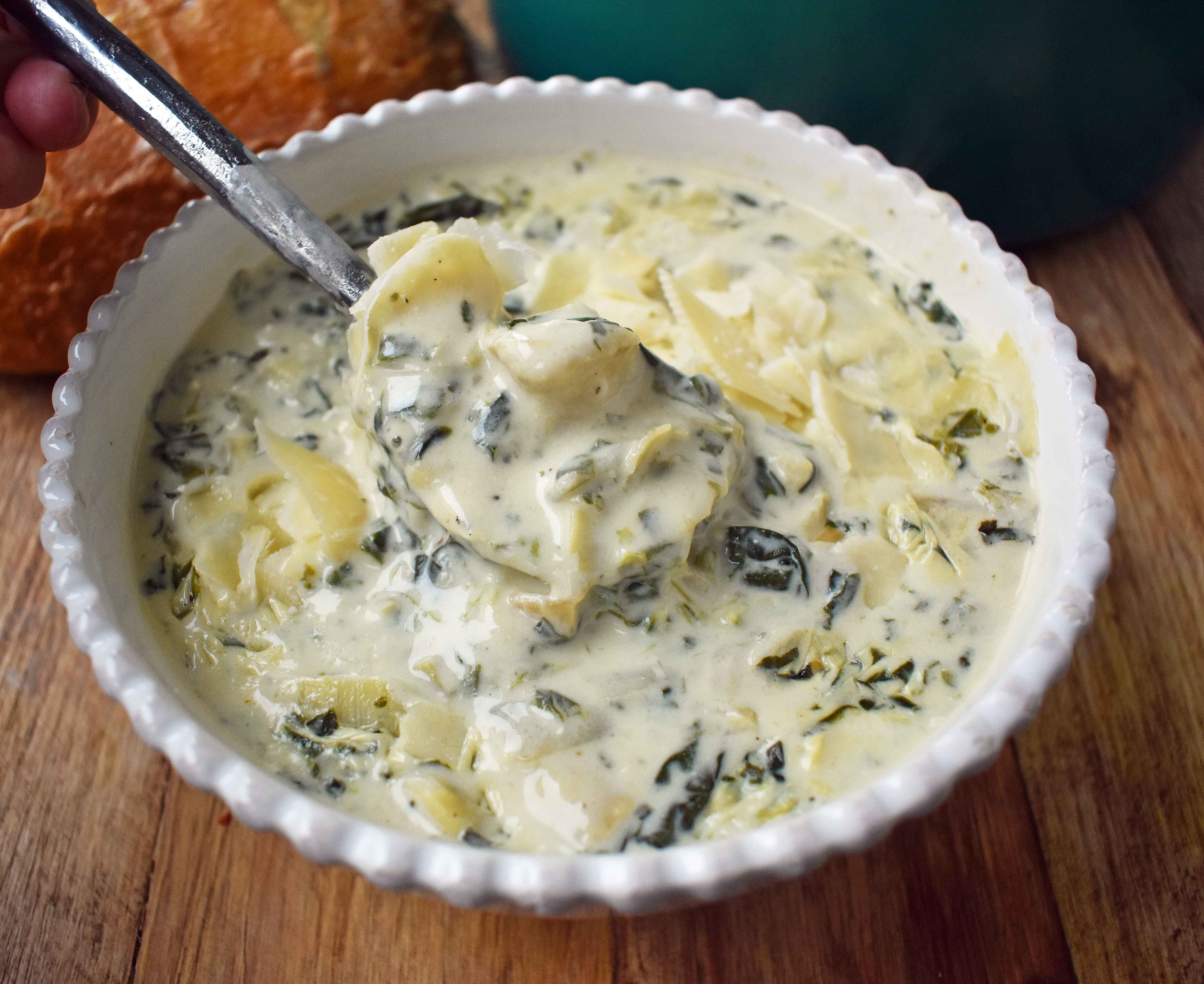 creamy spinach and artichoke soup in a bowl
