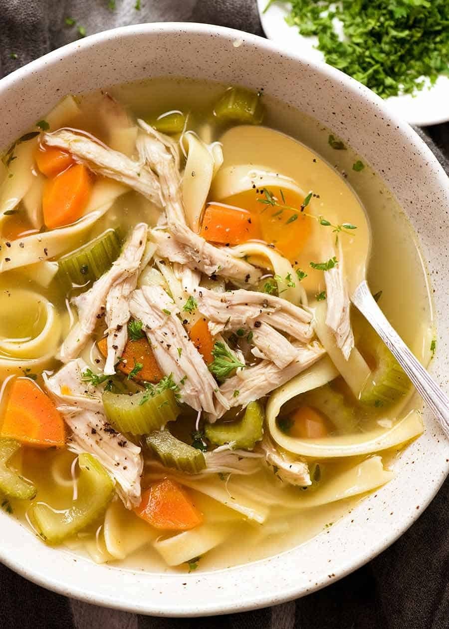 homemade chicken noodle soup steaming in a bowl