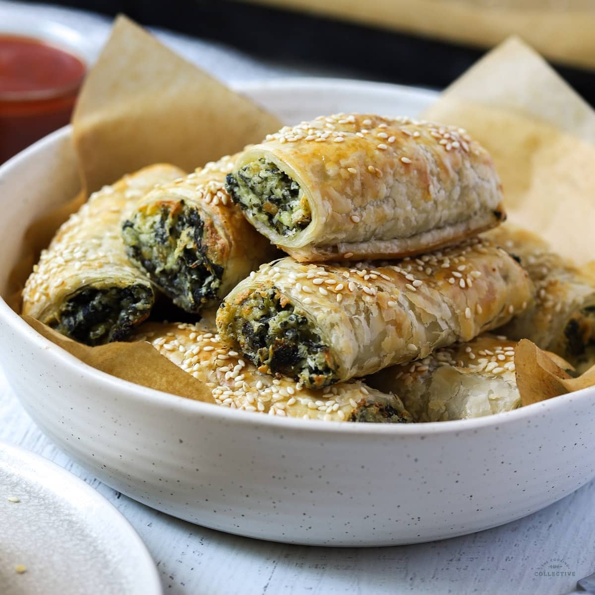 a batch of freshly baked spinach and ricotta stuffed sliders golden brown