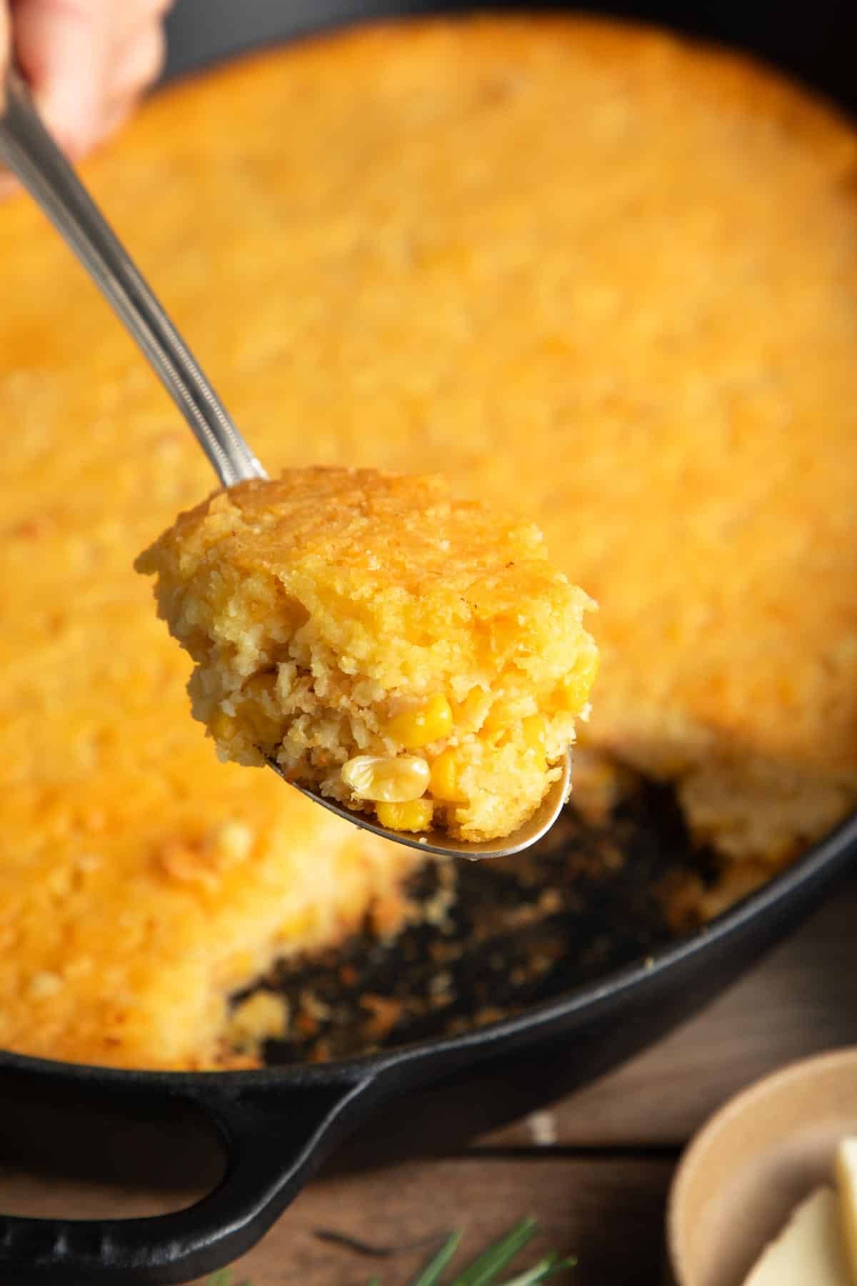 Southern corn casserole golden crust main dish served on a rustic table