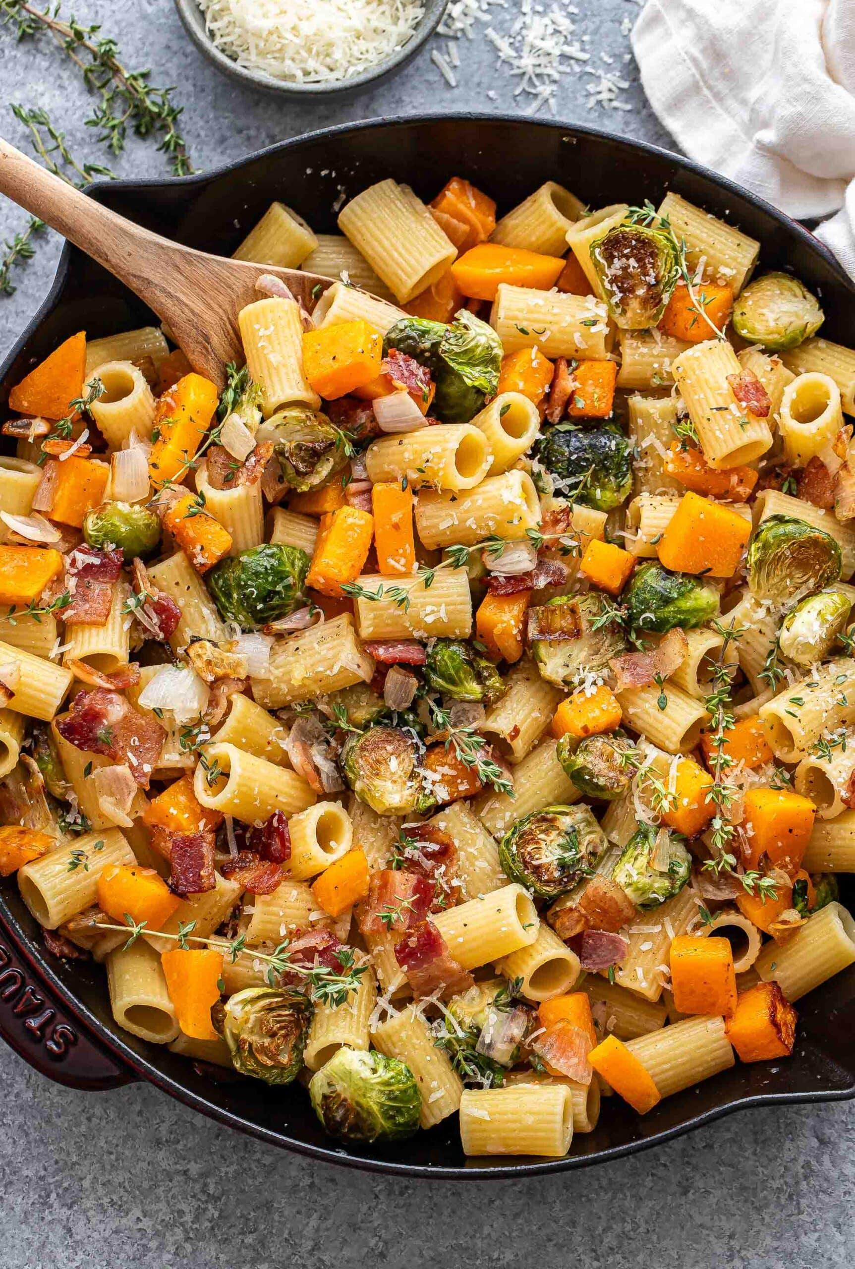 Butternut Squash Pasta with Roasted Brussel Sprouts and Bacon, autumnal setting, rustic kitchen