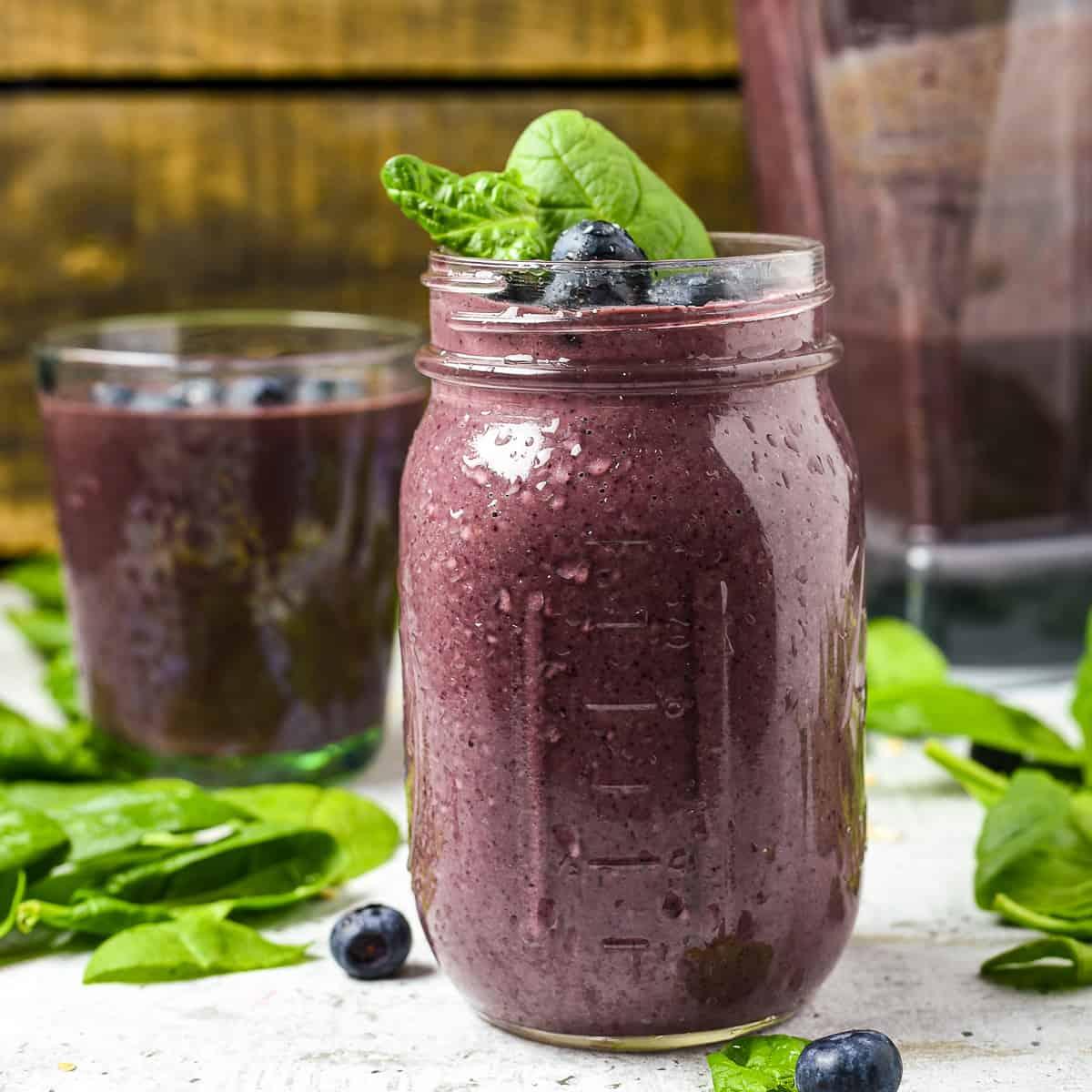 Close-up of a glass of the Berry Spinach Powerhouse smoothie with condensation