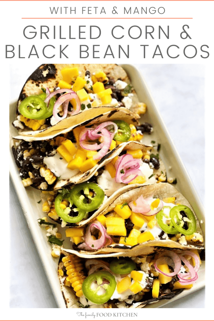 A vibrant image of grilled corn and black bean tacos, garnished with fresh cilantro and lime wedges