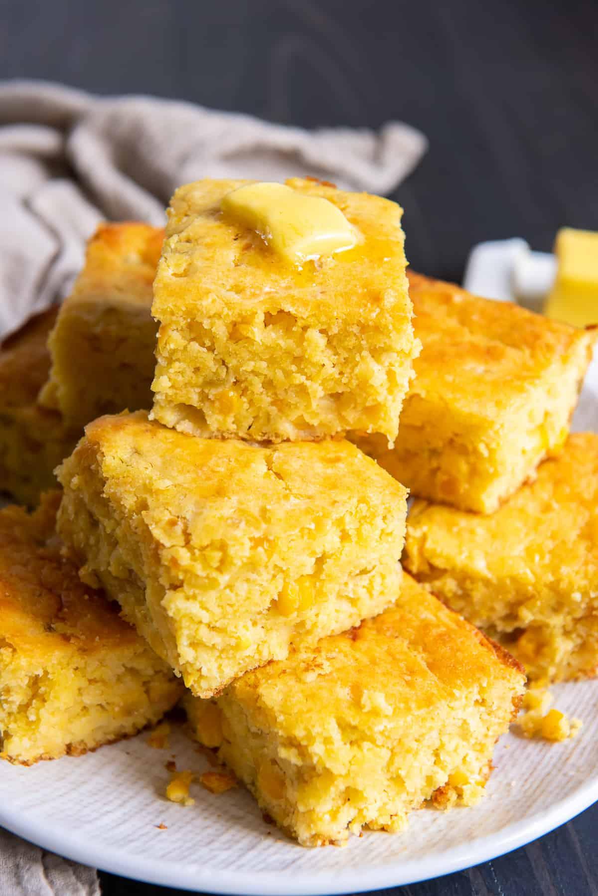 A photo showing a whole pan of cornbread with onions, ready to be served at a potluck.