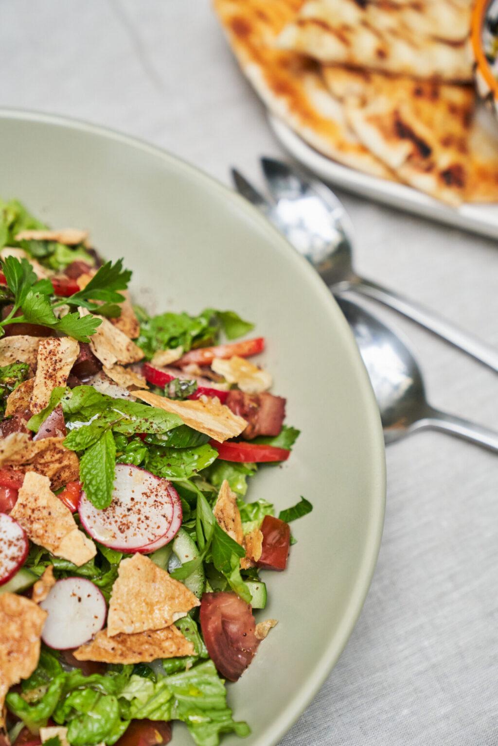 A beautifully styled photo of the finished Fattoush salad